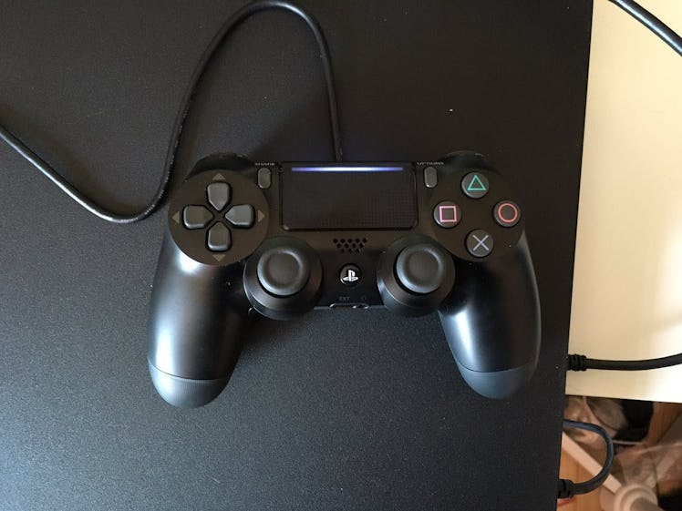 PS4 controller on a black console