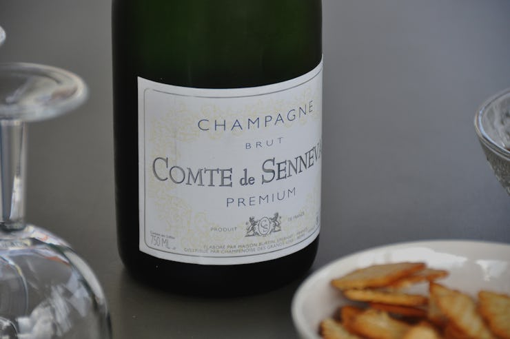 A champagne bottle served on a dinner table