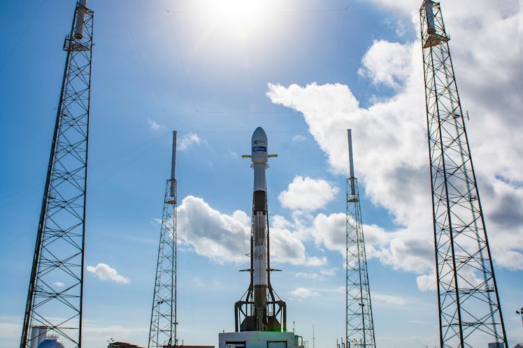 The Falcon 9 vertical on the launchpad.