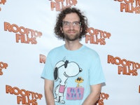 Kyle Mooney posing for a photo in a light blue shirt