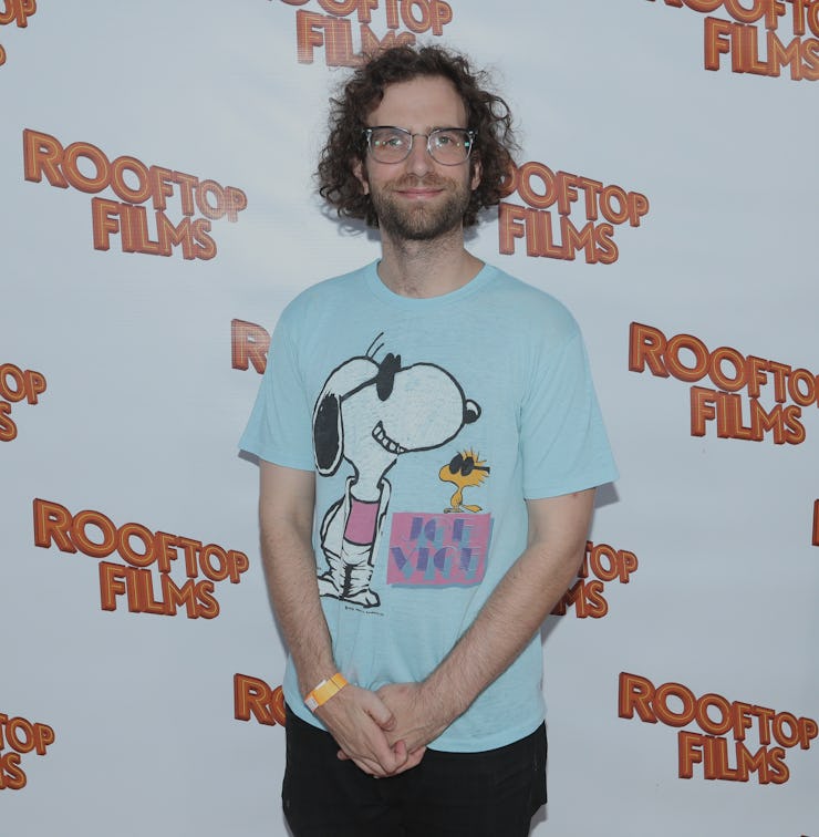 Kyle Mooney posing for a photo in a light blue shirt