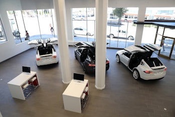 SAN FRANCISCO, CA - AUGUST 10: Three Tesla Model X's are displayed inside of the new Tesla flagship ...