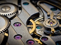 A close-up of a clockwork that represents time