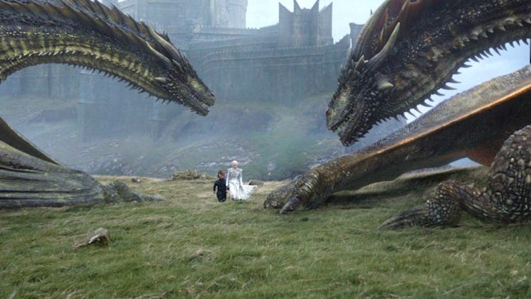 On Dragonstone, Tyrion and Daenerys walk near Rhaegal and Viserion.