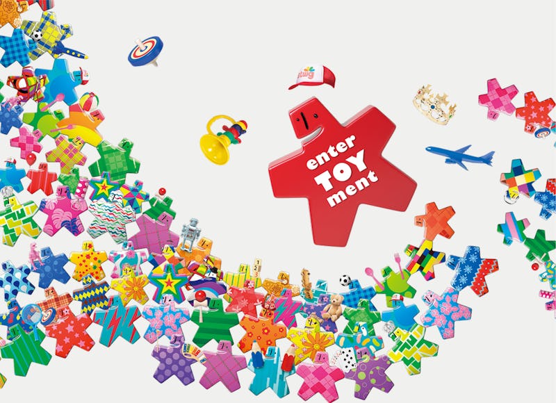 A promotional poster for the Tokyo Toy Show with various multi-colored puzzle-like elements.