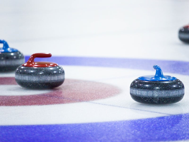 Four curling stones on Ice for the Curling sport