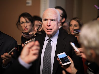 John McCain talking to journalists