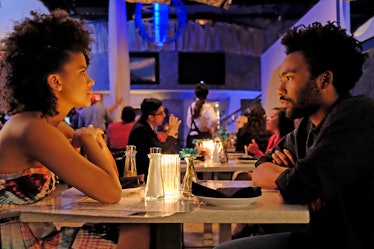 Donald Glover and Zazie Beetz are sitting in a restaurant having dinner.