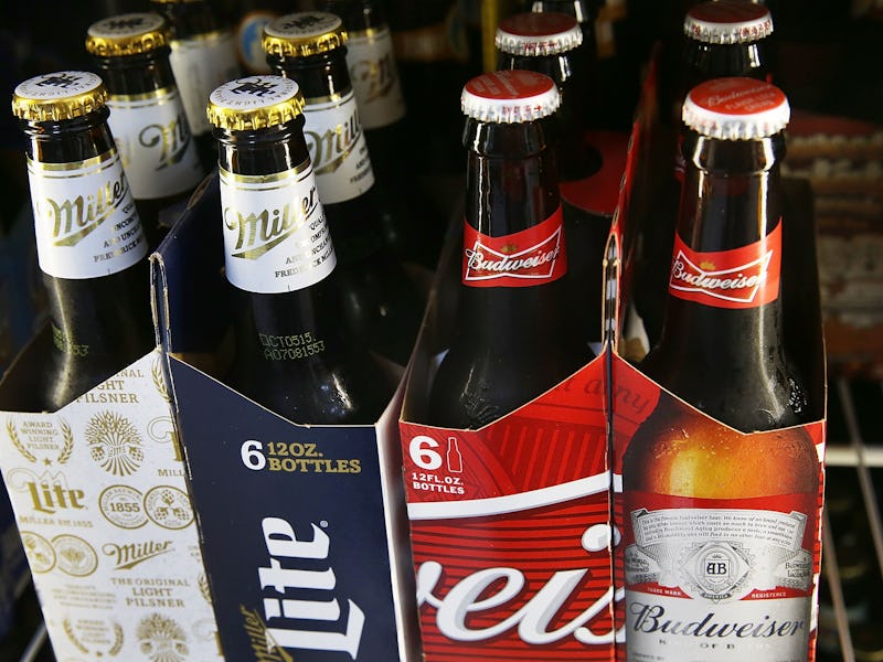 Two 6-packs of beers representing the Anheuser-Busch Inbev-Sabmiller merger
