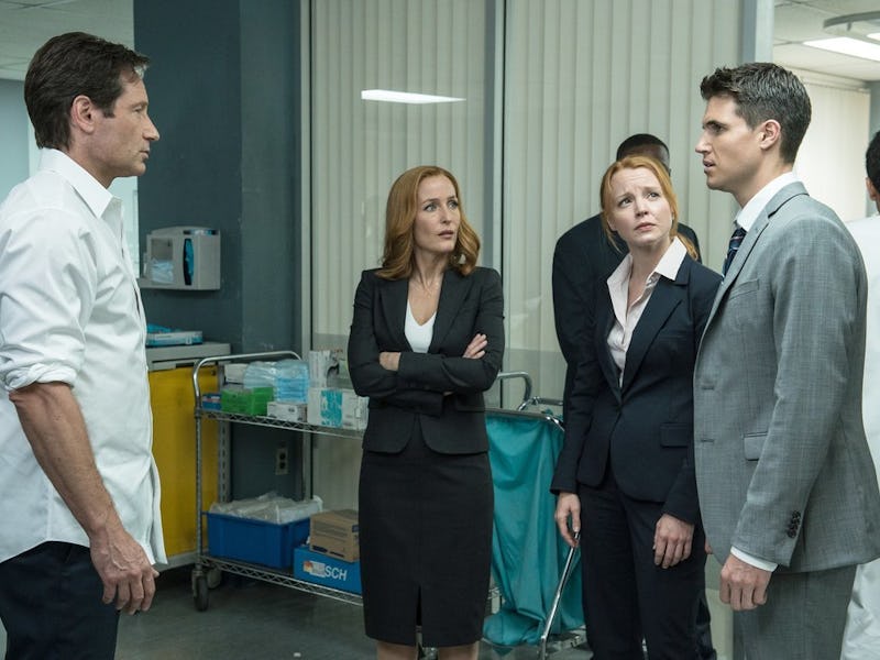 Hospital scene from the X-Files in which agents Scully and Molder are speaking with a man in a grey ...