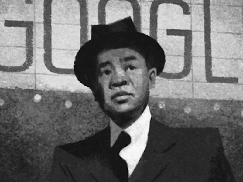 James Wong Howe in a suit and hat in black and white