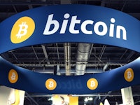 Large blue Bitcoin sign 