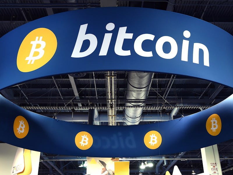 Large blue Bitcoin sign