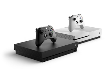 The Xbox One X next to the Xbox One S.
