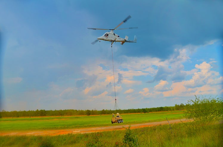 A "Dismounted Soldier Autonomy Tools," or DSAT, being lowered by a helicopter