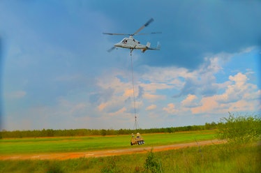 A "Dismounted Soldier Autonomy Tools," or DSAT, being lowered by a helicopter