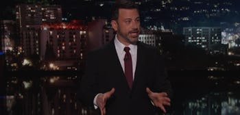 Jimmy Kimmel in a black suit and white shirt being emotional while he shares the story of his newbor...