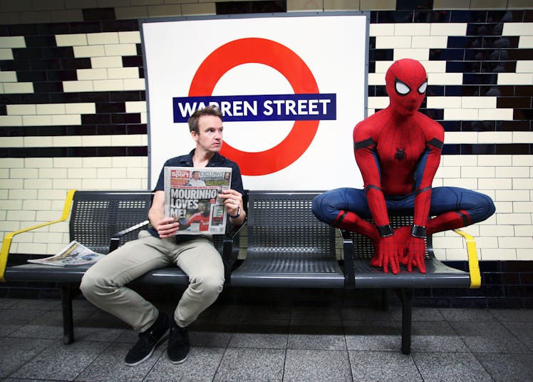 Even Spider-Man has to wait for the tube sometimes.
