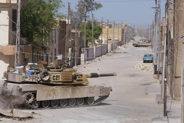 NAJAF, IRAQ - AUGUST 17: American Army Abrams M1 tanks from the 1st Cavalry Division 2nd Battalion 7...