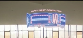 The holographic banner in 'Children of Mars' proclaiming "Happy First Contact Day."