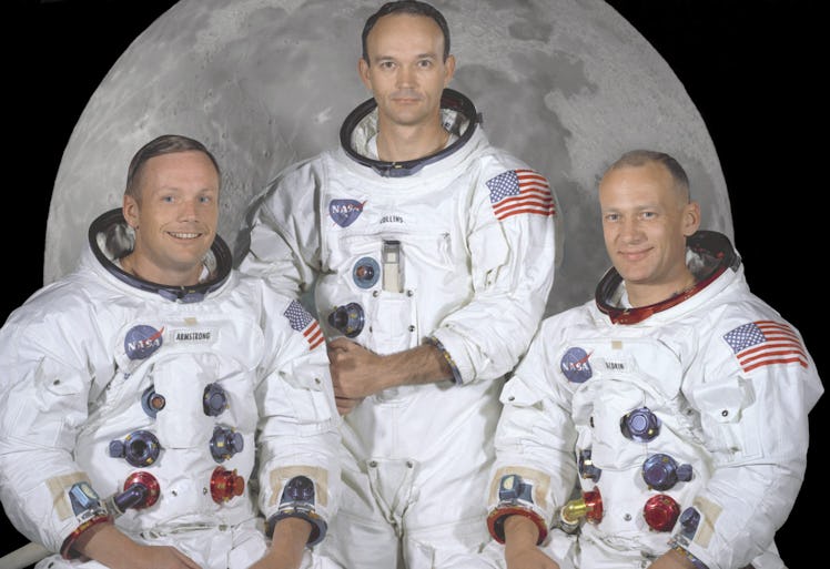 Neil Armstrong, Michael Collins, and Buzz Aldrin posing together for a photo