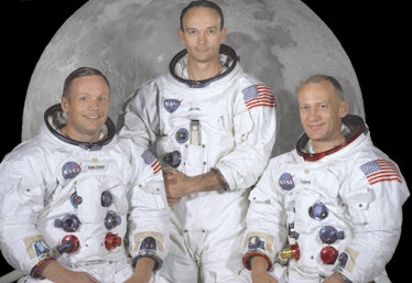Neil Armstrong, Michael Collins, and Buzz Aldrin posing together for a photo