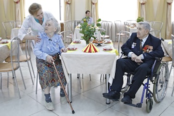 A nurse looking over patients at a home for the elderly in Russia. Jobs like these, requiring empath...
