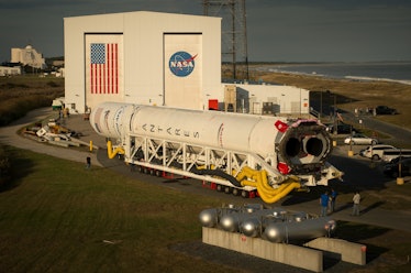 The Orbital ATK Antares rocket is rolled out of the integration facility and to the launch pad on Oc...