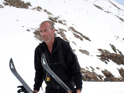 Explorer Henry Worsley on a mountain site, carrying ski equipment