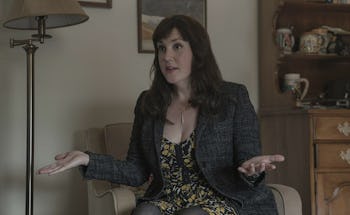 Molly Strand from 'Castle Rock' sitting in a room and talking to someone.
