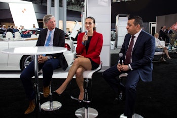 Monika Mikac, center, speaks at the Supercars Forum at the New York Auto Show. 