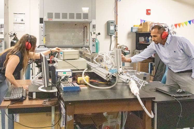 The team behind the recent study test out the mini-detonation in their lab at UCF