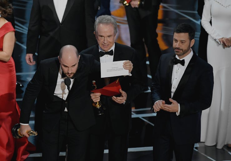 Jordan Horowitz, Warren Beatty, and host Jimmy Kimmel onstage during the Academy Awards in 2017