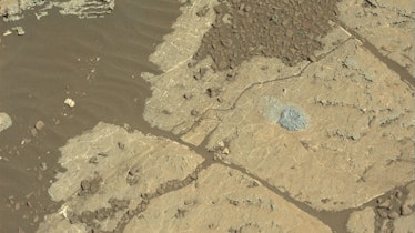 NASA's Mars rover Curiosity used a new drilling method to produce a hole on Feb. 26, 2018, in a rock...