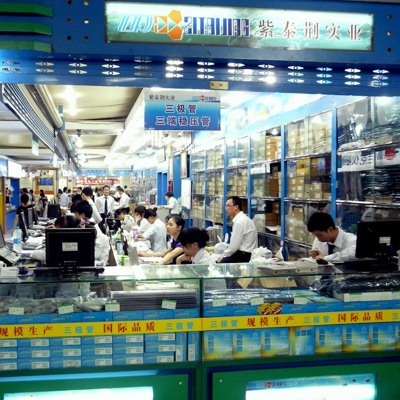 The Shenzhen Electronics Market full of workers wearing white uniforms