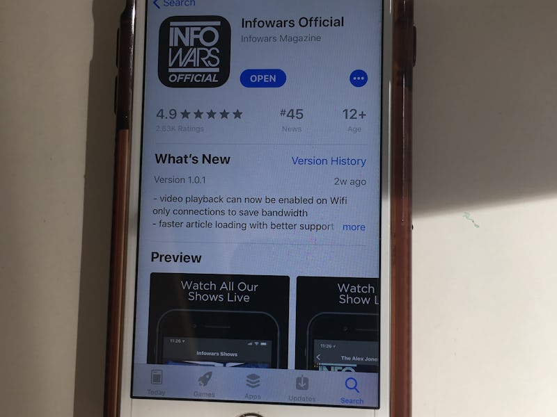 An iPhone with the App Store opened on the "Infowars Official" app