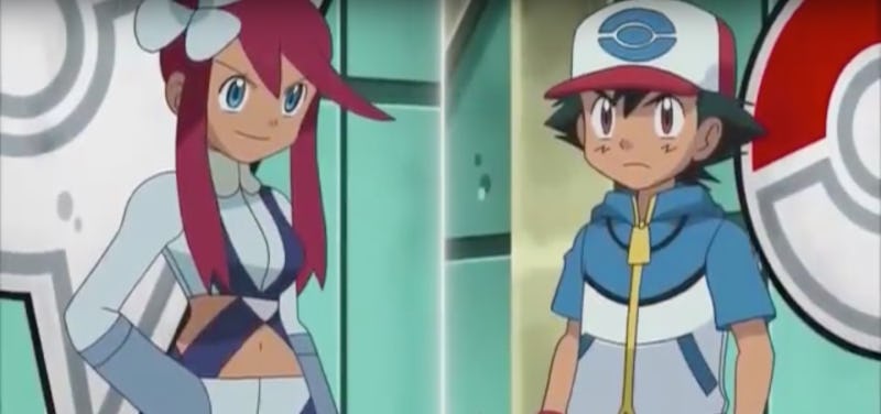 Ash and Skyla in Pokémon standing next to each other looking into the distance