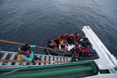 Passengers disembark the Akademik Ioffe after the Russian ship ran aground in the Canadian Arctic.