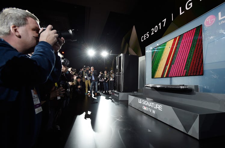 Members of the media photograph the LG Signature OLED TV W during a LG press event on Wednesday in V...