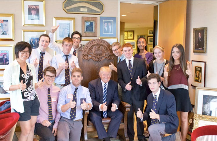 The Lampoon staff, posing as student journalists from the Crimson, with now-President Donald Trump. 