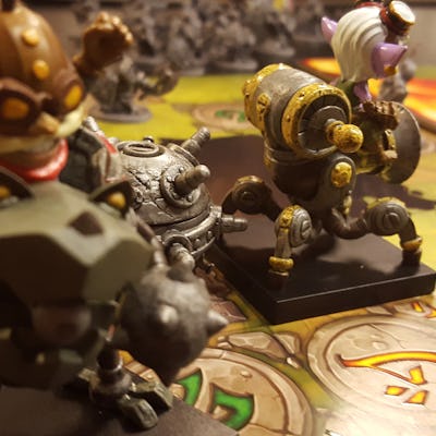 Mechs vs. Minions figures placed on a board