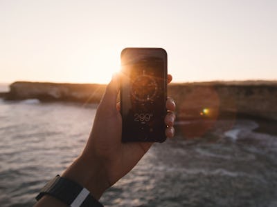 A person watching the Eclipse through a phone