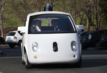 U.S. Transportation Secretary Anthony Foxx and Google Chairman Eric Schmidt driving in a Google self...