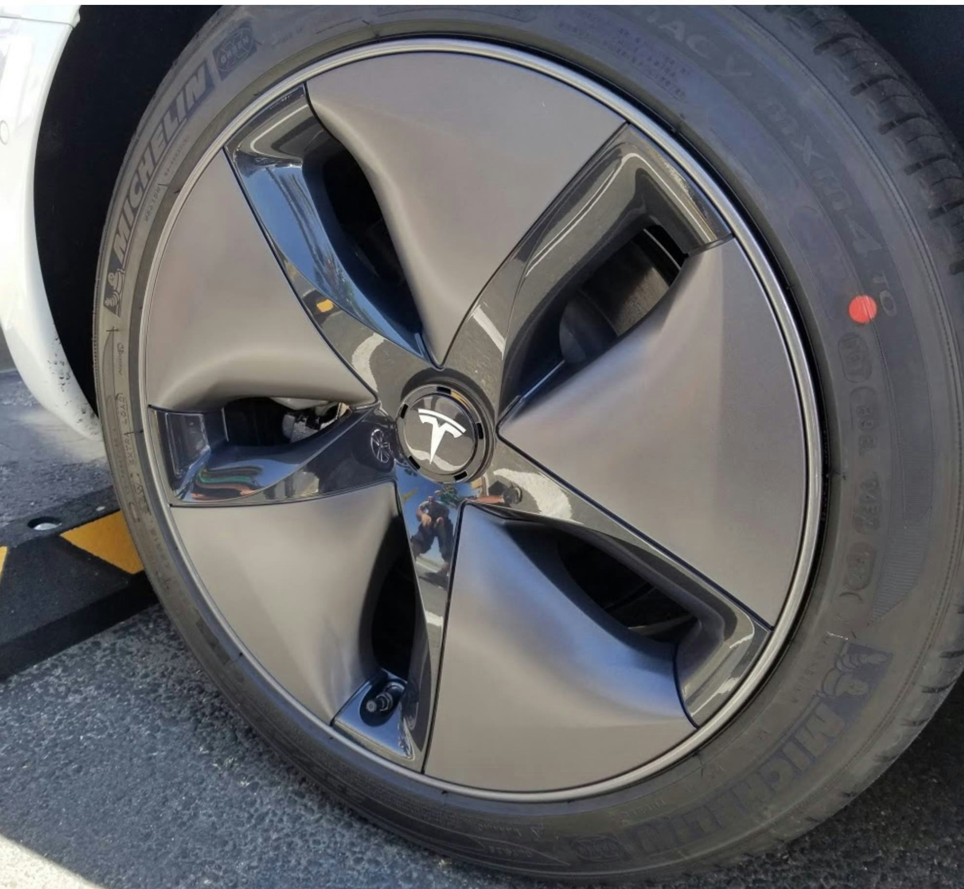 tesla rims under hubcaps