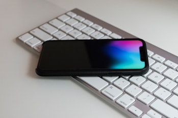 The iPhone X on a table.