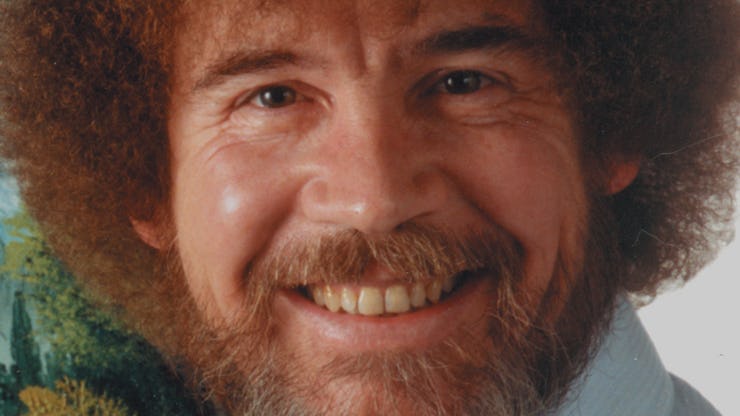 An insert from a video of Bob Ross with him smiling 