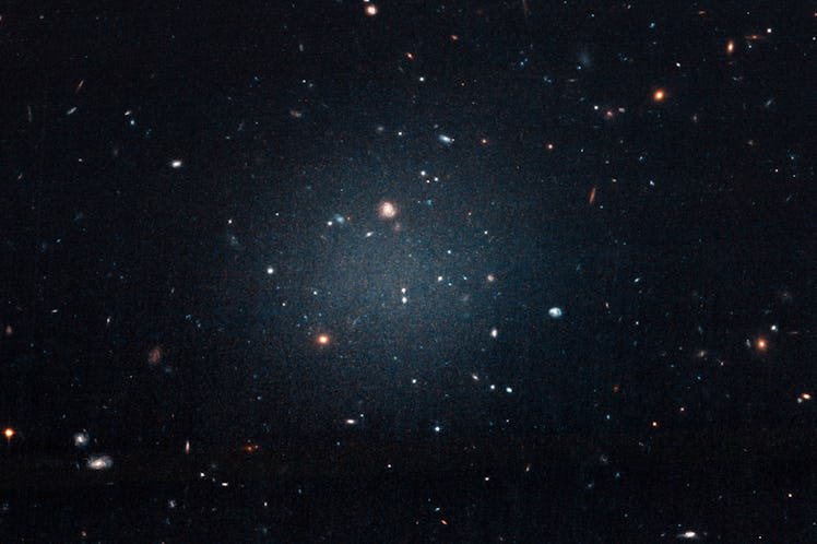 This large, fuzzy-looking galaxy is so diffuse that astronomers call it a “see-through” galaxy becau...