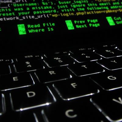 A close-up of a black keyboard of a laptop