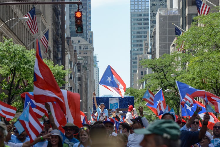 People marching up the Fifth Avenue in New York during the annual Puerto Rican Day Parade