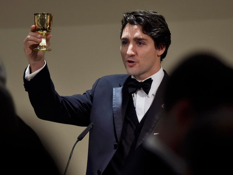 Justin Trudeau holding a small golden cup while explaining why Canadians don't like Americans